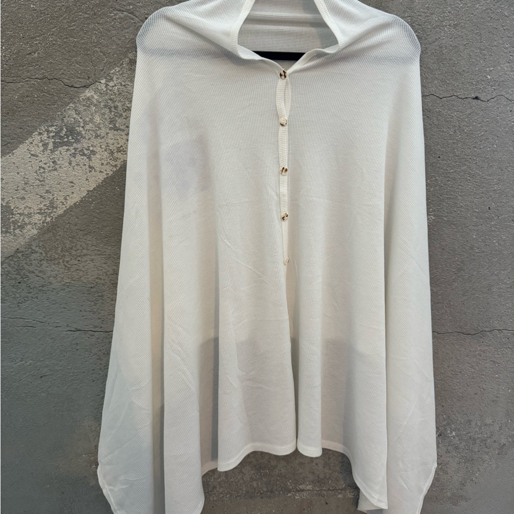 White  Birch cape top. Buttons up one side